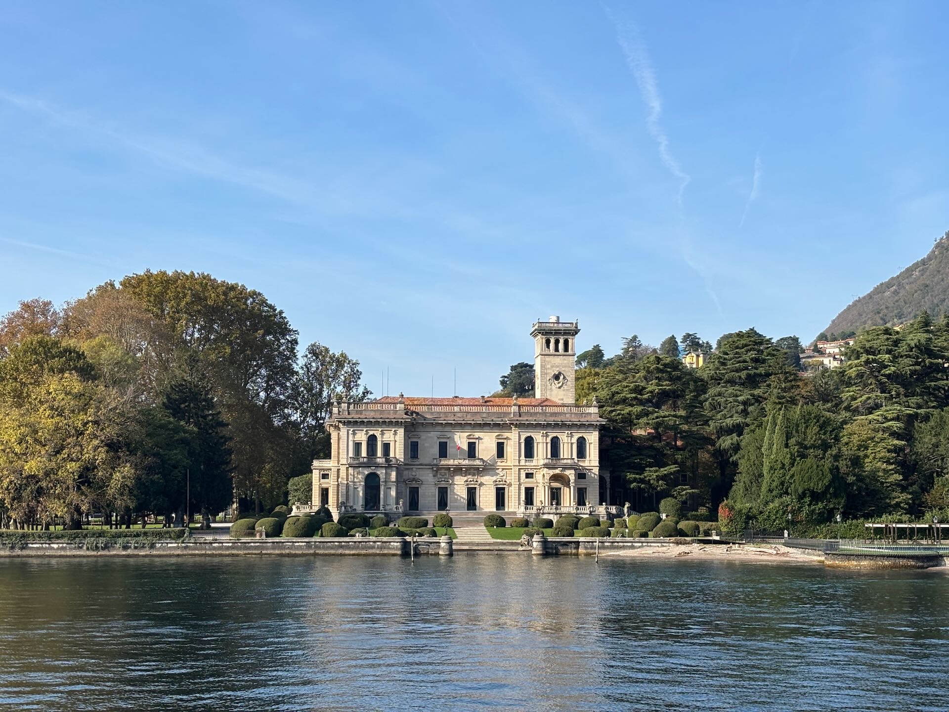 Morning light on Lake Como, golden water reflecting mountains